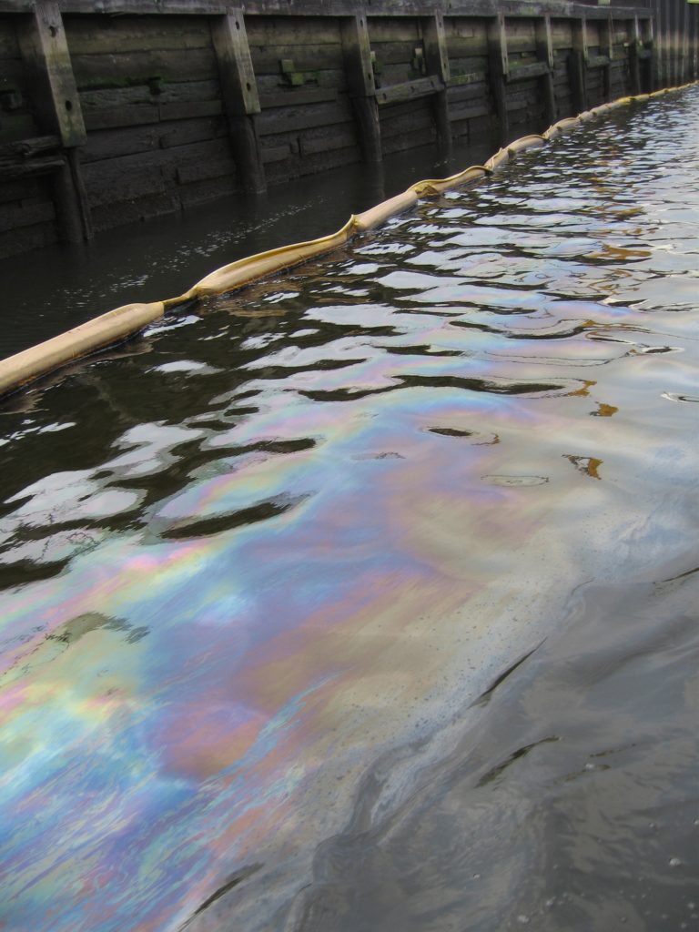 Oil sheen on Newtown Creek, where as much as 30 million gallons of oil leaked from a Brooklyn ExxonMobil refinery over the course of a century, contaminating ground water in the area. 