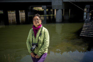 Waterkeeper Wang Yongchen poses for a portrait next to Xibahe river in Beijing. 